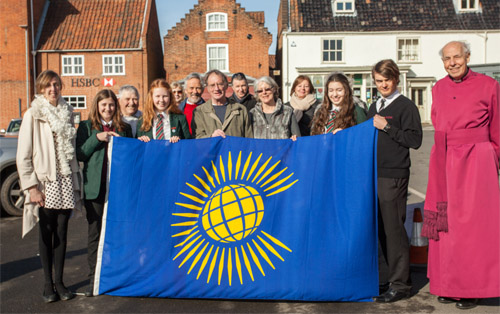 RHSC students Ruby Dodden, Jenny Garrod, Libby Fox and Ross Walters join officials from Reepham Town Council, Bishop Tony Foottit and members of the public at the Fly a Flag for the Commonwealth event. Photos: John Tym www.tympix.com