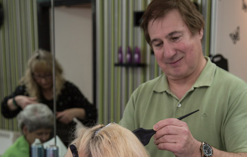 Leslie Tooley at work in Reepham Hair Studio (picture taken before Covid-19 guidelines). Photo: John Tym