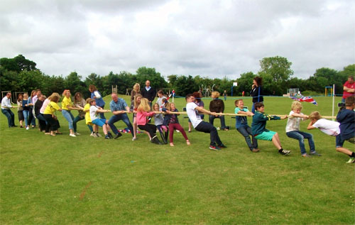 Cawston villagers participating in the tug of war at the Cawston Commonwealth Games