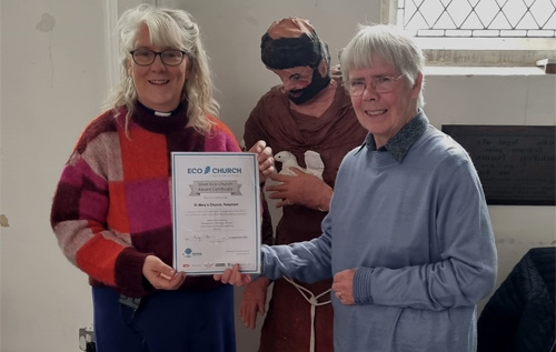 The Silver Eco Church Award certificate being presented to Rachel Richmond (right), St Mary's Eco Church lead, by the rector, Revd Helen Rengert, at the Café Church service, which was celebrating the life of St Francis of Assisi. Photo: Lynne Gower