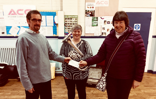 Left to right: Paul Foster, manager, Aylsham Band; Vikki Wakefield, baritone player, Aylsham Band; and Liz Gaymer, Reepham Lions.