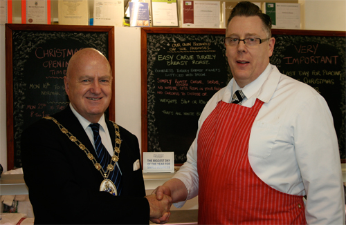 Chairman of Broadland District Council Cllr Stuart Dunn (left) meets Reepham butcher Brian Robertson