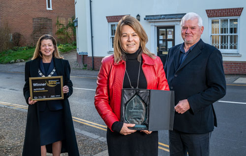 From left: Cllr Karen Vincent, chairman of Broadland District Council, presents the award outside myDNAhealth's office in Reepham to Bernie Williams, chief executive officer, and Malcolm Williams, chief operating officer. Photo: Simon Finlay Photography