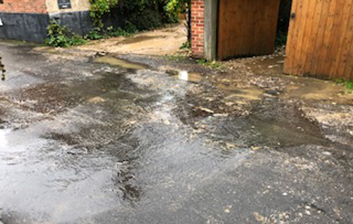 Foul water drain floods Back Street, Reepham. Photo: submitted