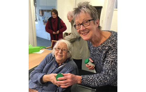 Margaret Lake (left) receives her Message in a Bottle from Liz Howes, Reepham Lions member, at the Reepham & District Day Centre