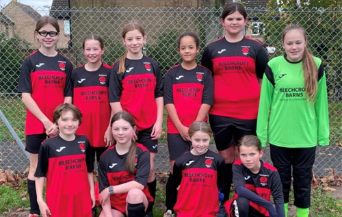 Cawston Red Rose under 12 girls' football team in their new sponsored kit. Photo: Red Rose FC