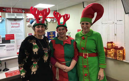 Reepham Post Office staff in Christmas fancy dress for good causes. Photo: submitted