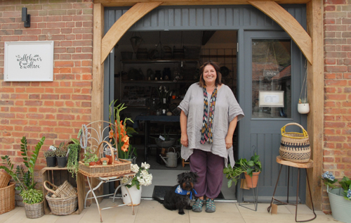 Karen Wheeler and Wallace outside The Wallflower & Wallace, Heydon.