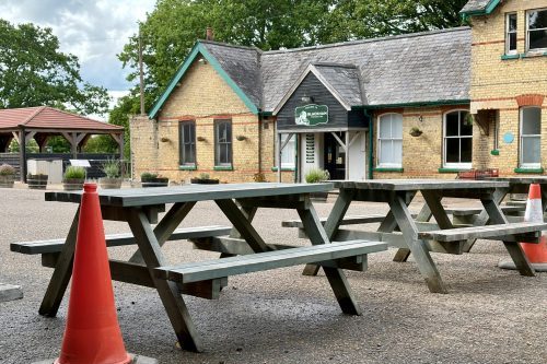 Cones and benches block the parking area in front of Blackham Station Café on 4 June